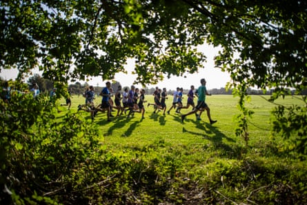 People taking part in a parkrun on Coldham Common, Cambridge.