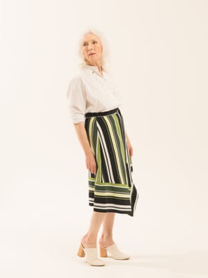 white shirt with embroidered pattern on the front Label Mix/Anne Bernecker from next.co.uk green black and white striped skirt next.co.uk white mules marksandspencer.com , hoop earrings Whistles