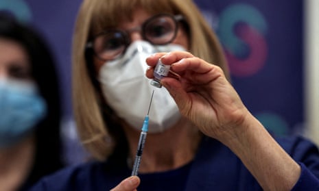 A nurse prepares a fourth dose of coronavirus disease (COVID-19) vaccine as part of a trial in Israel.