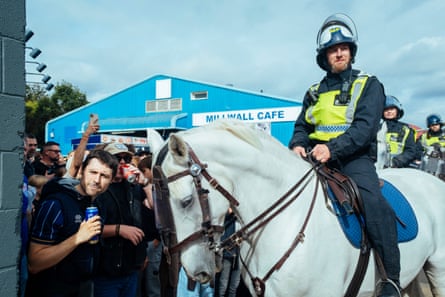Mounted police keep fans at bay outside the Den