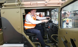 Going nowhere: Scott Morrison sits at the wheel of a a truck during a factory visit in Brisbane in August.