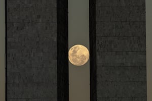 The supermoon between the two towers of the National Congress building, in Brasilia, Brazil