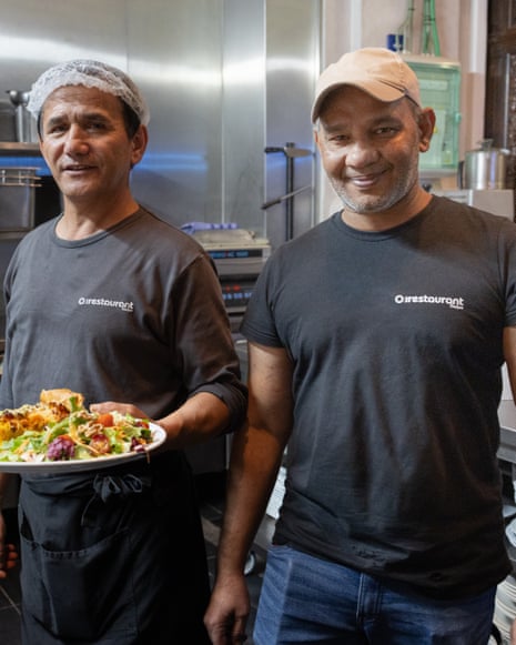 Haidar Saghi (left) and Jafar Khan Chughtai, two staff members at restaurant Parnassus, Ghent. Parnassus is a social restaurant and meeting centre run by the non-profit organisation Ateljee.
The restaurant is located in a unique, historic setting: the former Franciscan church (Minderbroederskerk) on the Oude Houtlei.