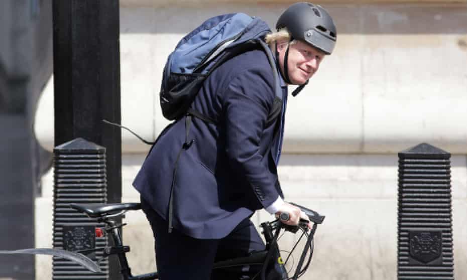 Boris Johnson cycling.