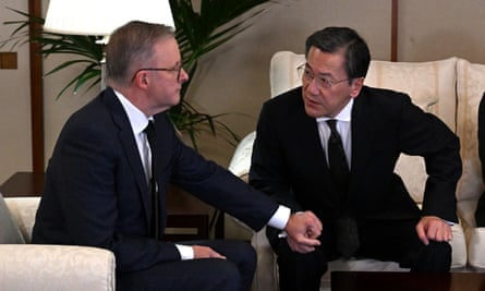 Anthony Albanese and Shingo Yamagami hold hands