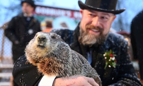 Punxsutawney Phil, with handler AJ Dereume, at Gobbler’s Knob, where the annual ceremony takes place.