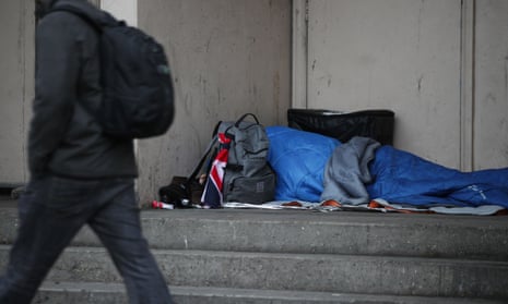 A person sleeping rough in a doorway