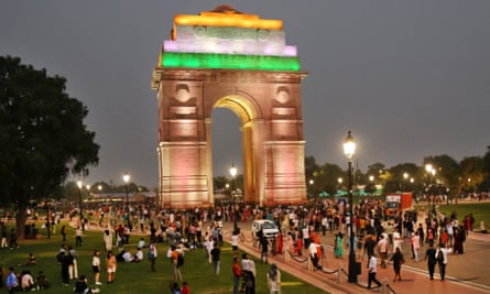 Visitors gathered at India Gate in Delhi.  Will India's increasing number of young people be able to find a job?