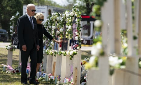 President Joe Biden and first lady Jill Biden visit a memorial at Robb elementary school to pay their respects to the victims of the mass shooting, Sunday,  in Uvalde, Texas. 