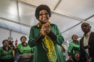 Winnie Mandela acknowledges a crowd of ANC Women’s League supporters gathered to celebrate her 80th birthday