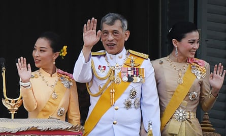 Thailand’s King Maha Vajiralongkorn with Princess Bajrakitiyabha Mahidol and Queen Suthida, all waving
