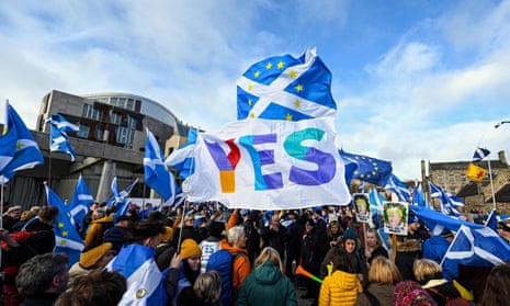 Activists outside Scotland’s Holyrood parliament building support independence.