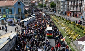 Demonstrators march on central La Paz to protest the killings in El Alto.