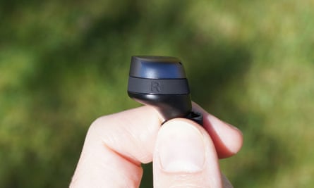 A side profile shot of an earbud showing the rubber stabiliser wing