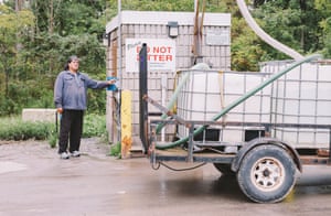 Larry Jamieson collects water.