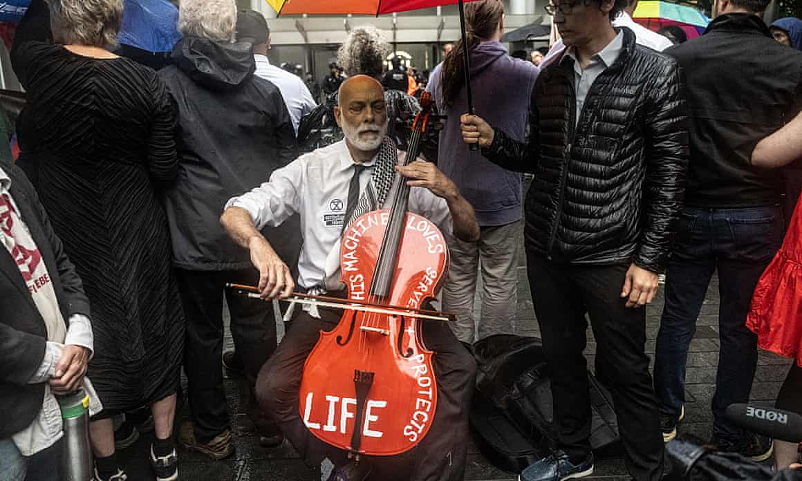 John Mark Rozendaal plays a cello in front of Citibank headquarters on 8 August 2024 in New York City