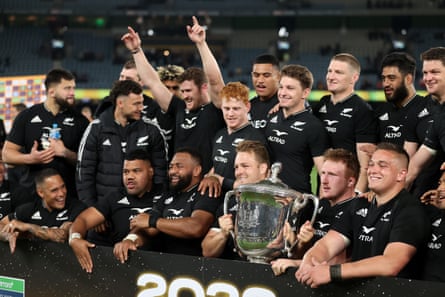 All Blacks players celebrate after retaining the Bledisloe Cup.