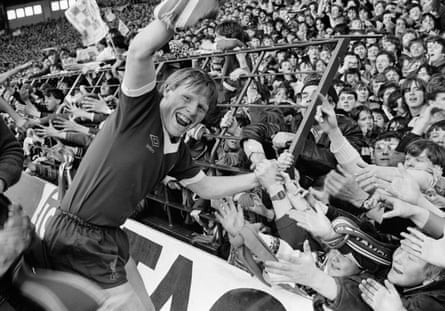 Lee celebrates wining the First Division title with the Liverpool fans on the Kop in 1980.
