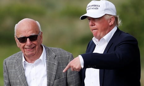 Rupert Murdoch and Donald Trump pictured on a golf course in Scotland in 2016. 
