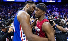 Joel Embiid hugs Miami Heat forward Jimmy Butler after the 76ers’ win on Wednesday night