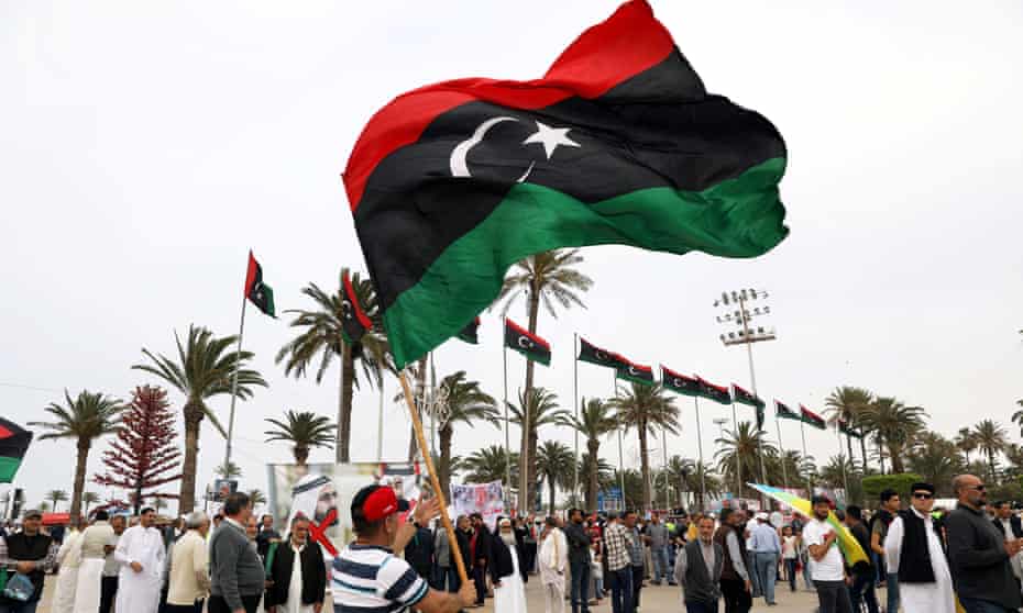 A man waves a Libyan flag during a demonstration in April to demand an end to Khalifa Haftar’s offensive against Tripoli