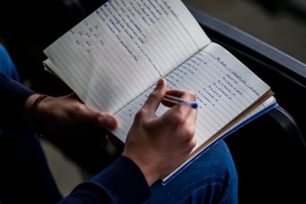 A scout makes notes during a 2023 EFL Trophy match between MK Dons and Chelsea Under-21s
