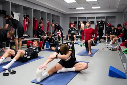 The Exeter City players stretch in their Etihad dressing room before kick-off