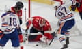 Edmonton Oilers forward Connor McDavid (97) reaches for the puck against Florida Panthers goaltender Sergei Bobrovsky (72) during the third period of Saturday’s Game 1.