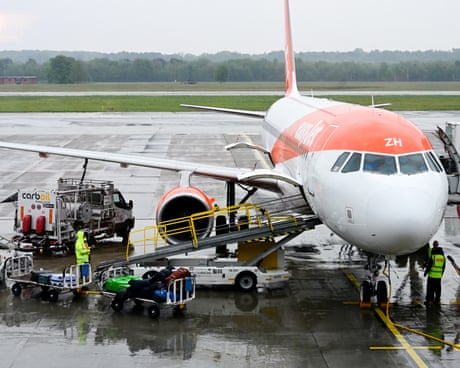 Ground crew servicing an EasyJet aircraft at Milan's Malpensa airport