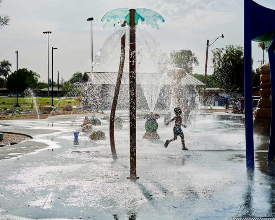 Children play in a water park on a hot June afternoon where temperatures reached 110 degrees, in Brawley.