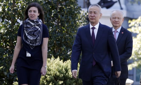 China’s Vice-Premier Liu He, second from right, arrives at the West Wing of the White House in Washington for a meeting with Donald Trump, on Friday.