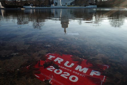 trump sign under water in capitol reflecting pool