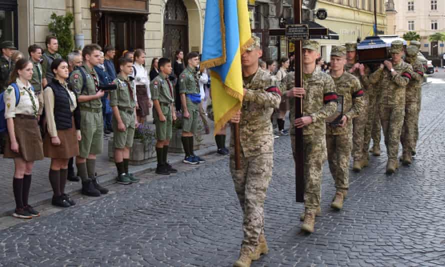 Ukrainian servicemen carry a coffin with the body of their comrade Artem Dymyd, who was recently killed in a battle against Russian troops, as Russia’s attack on Ukraine continues, during a funeral ceremony in Lviv, Ukraine June 21, 2022.