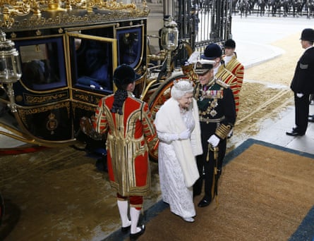 Queen Elizabeth II and the Duke of Edinburgh arrive for the state opening of parliament in 2013.