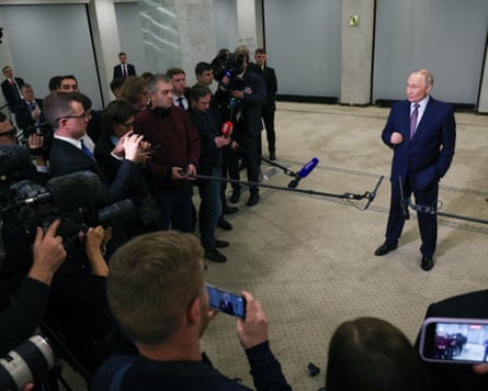 Vladimir Putin speaking to reporters