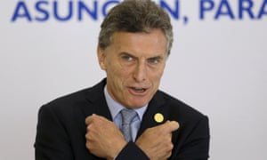 Argentina’s President Mauricio Macri gestures before the official photo at the Mercosur summit in Paraguay on Monday.