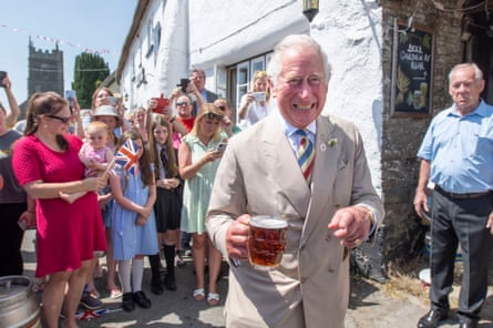 Prince Charles enjoys a pint at the Duke of York Public House in Devon.