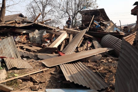 Corrugated panels and rubble are all that remains of a demolished house