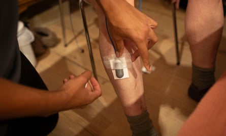 Phil Daoust seen having electrodes applied to his legs by Julius Patrick, a sleep physiologist at IPDiagnostics. 3 April 2024