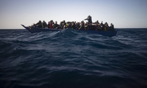 Migrants from Eritrea, Egypt, Syria and Sudan wait to be assisted by the Spanish NGO Open Arms after fleeing Libya last month.