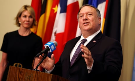 Mike Pompeo speaks as Kelly Craft listens at UN headquarters in New York on 20 August. 