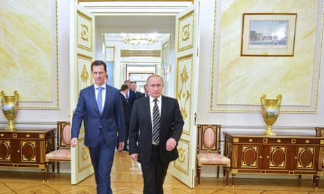 RUSSIA-SYRIA-CONFLICT-DIPLOMACYRussian President Vladimir Putin (R) greets his Syrian counterpart Bashar al-Assad upon his arrival for a meeting at the Kremlin in Moscow on October 20, 2015. Assad, on his first foreign visit since Syria’s war broke out, told his main backer and counterpart Putin in Moscow that Russia’s campaign in Syria has helped contain “terrorism”.