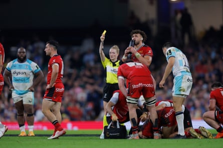 Hollie Davidson shows Will Muir a yellow card for clattering Ethan Dumortier in the air