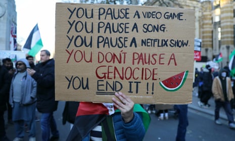 Protestors march in solidarity with Palestine, demanding a ceasefire amid the ongoing conflict between Israel and the Palestinian Islamist group Hamas on November 25, 2023 in London, England.