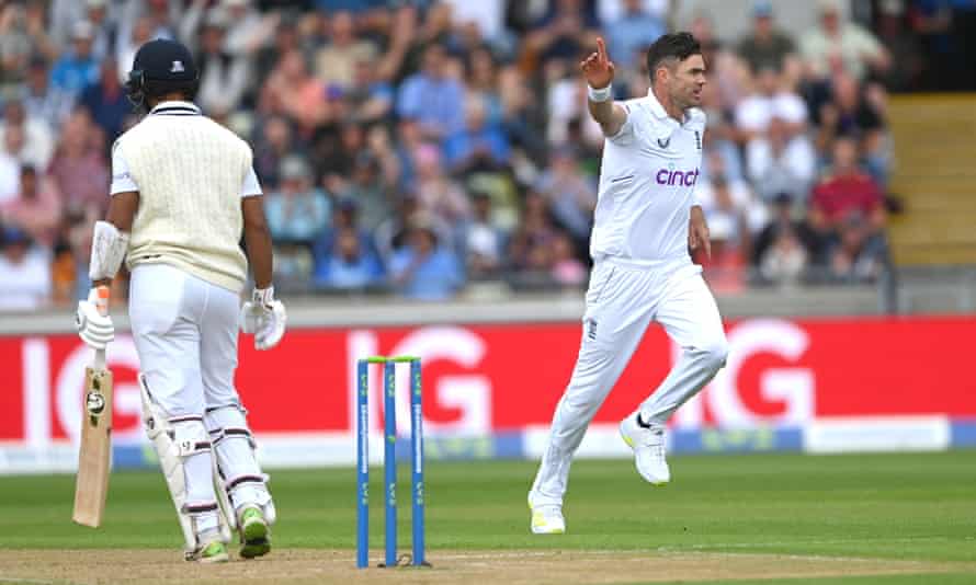 James Anderson celebrates after taking the wicket of Cheteshwar Pujara