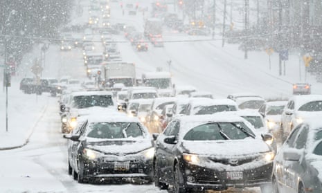 A traffic jam during a snowstorm in Towson, Maryland, 16 December. Treacherous weather could bury parts of the eastern US in snow, threatening transportation used by the vaccine manufacturing facilities.