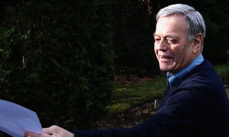 Tony Blackburn arrives at his home and hands a statement to the press