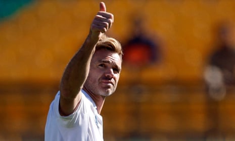 England's James Anderson salutes the Dharamsala crowd after taking his 700th Test wicket.