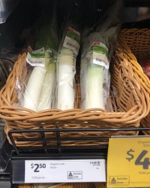 Individual organic leeks wrapped in plastic