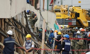 Rescue services and volunteers search for victims under the debris of the Mexico City school that collapsed in the earthquake.